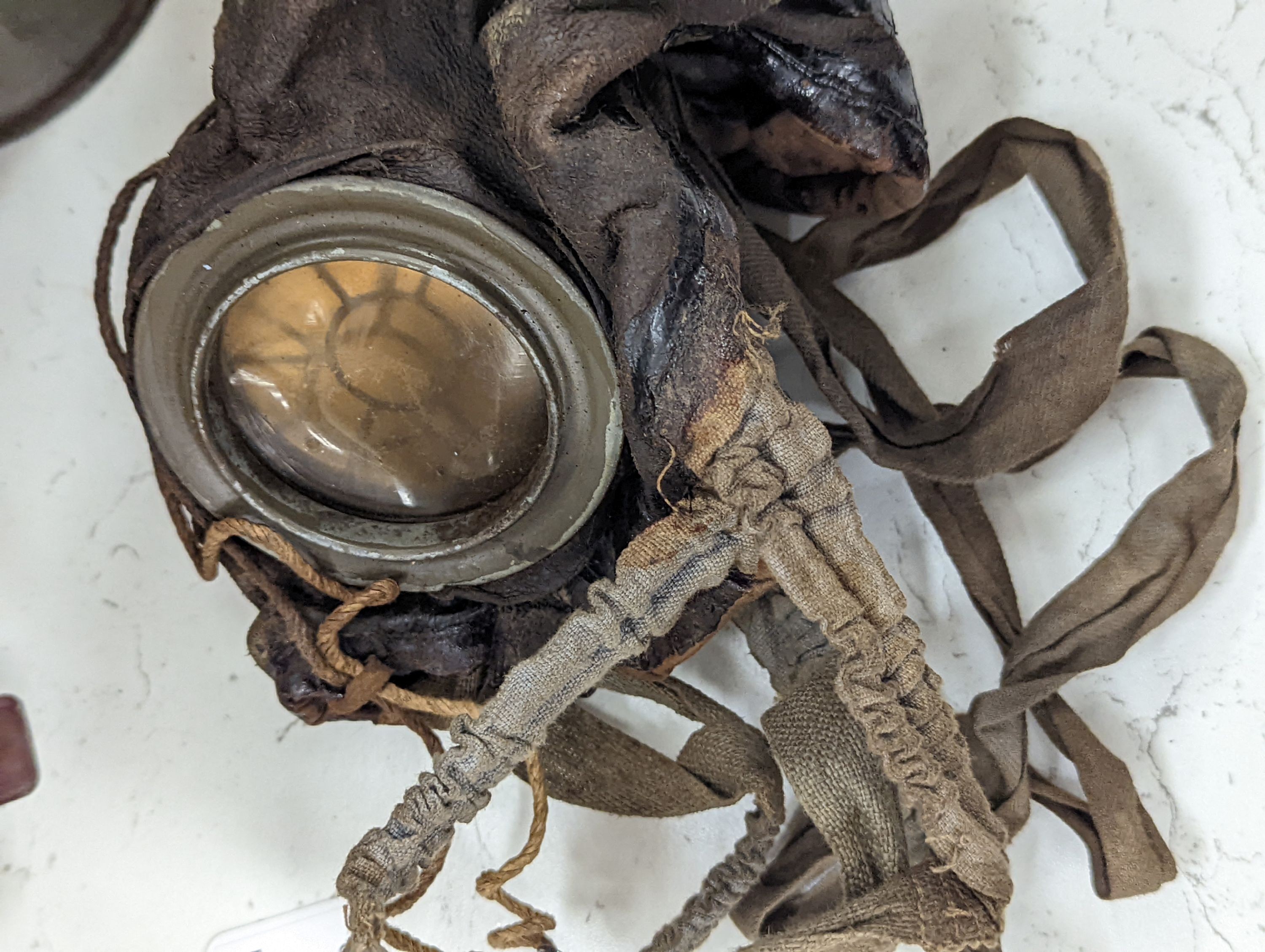 WWI German gas mask, two German trench mess tins and a German leather belt case